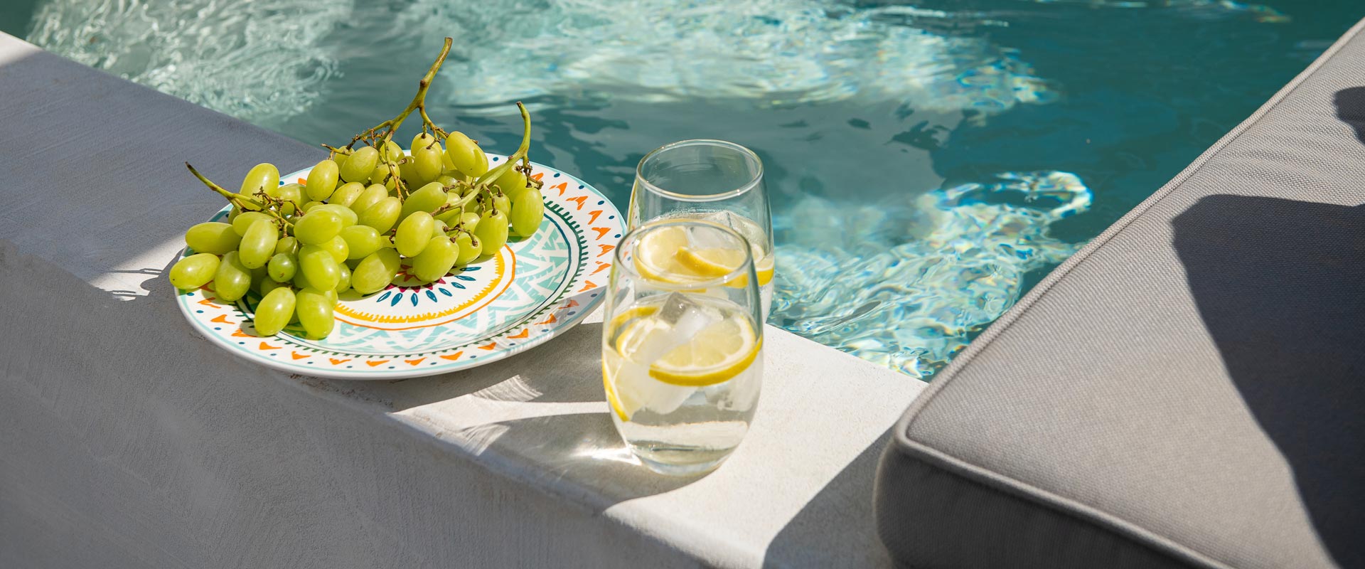 Grapes and drinks by the Pool