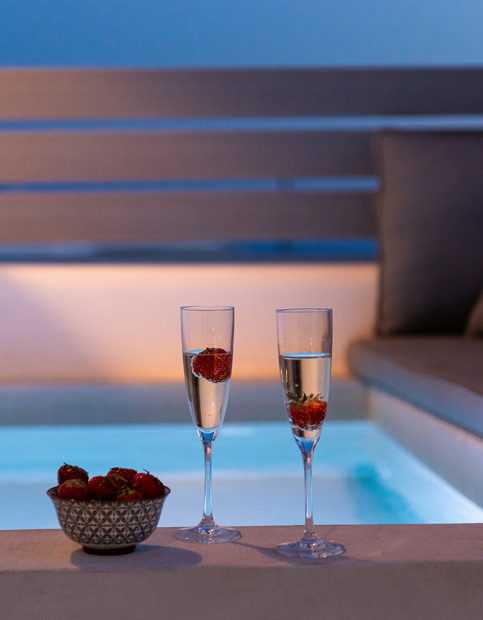 Mini Pool view at night with two glasses and strawberries