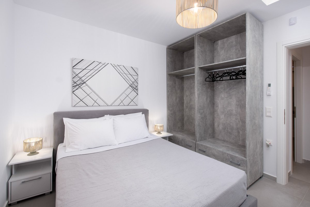 Grey Bedroom in Three Bedroom Semi Basement Apartment