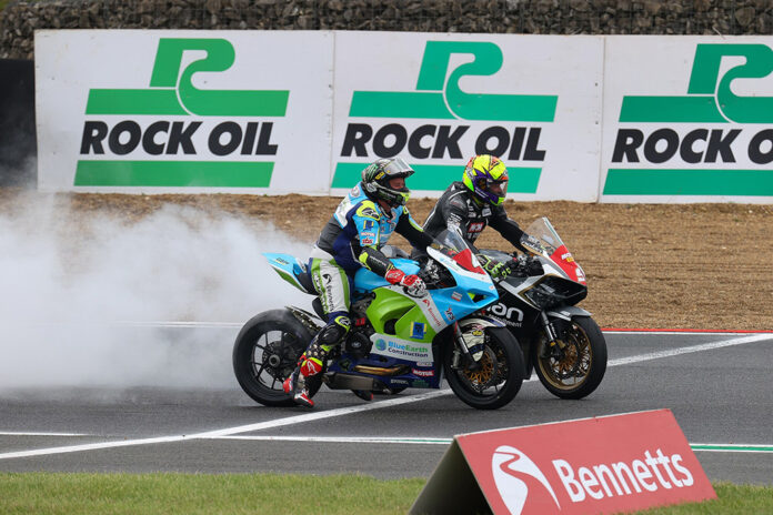 Chris ‘Stalker’ Walker wins at Brands GP and is joined on the podium by John McGuinness