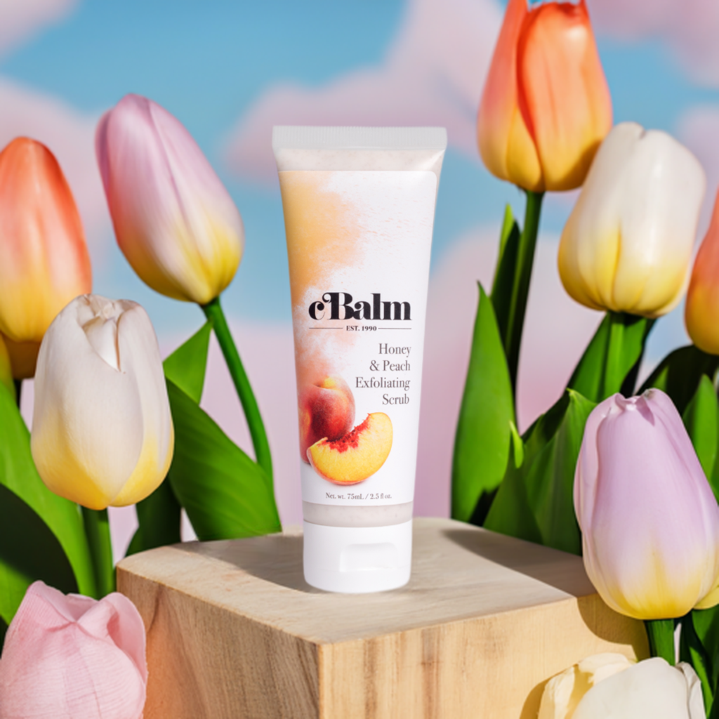 a tube of a skincare product surrounded by tulips