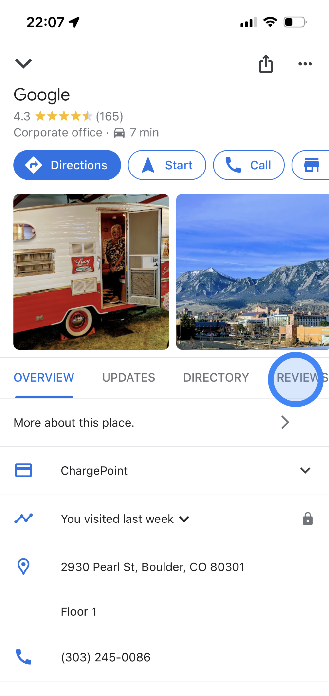 In the Google Maps app, information about a Google office location is displayed. There is information such as average review rating, photos, address, and phone number. In the middle of the screen, there are tabs available to tap. They are labeled Overview, Updates, and Reviews.