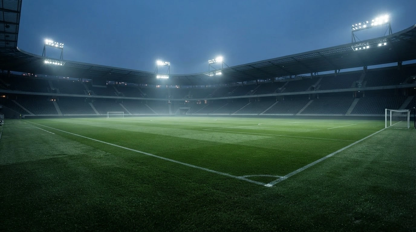 An empty football stadium at twilight highlights the absence of the reported Nations League match between Ukraine and Hungary.