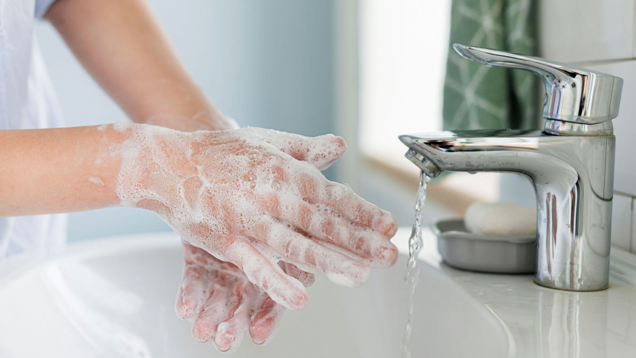 64830b116d7ef__side-view-of-person-washing-hands-in-the-sink.jpg