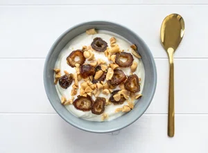 Quark bowl with dates and crushed peanuts