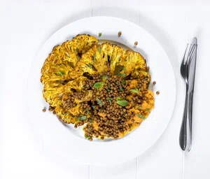 Spicy cauliflower steaks with lentils and vegetable puree