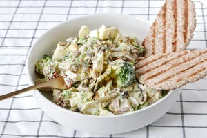 Broccoli salad with egg and pita bread