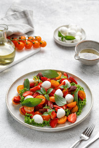 Cherry tomato and strawberries caprese salad