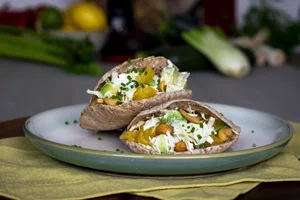 Pita breads with orange, avocado and cabbage salad filling