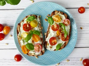 Toast with basil spread and cherry tomatoes