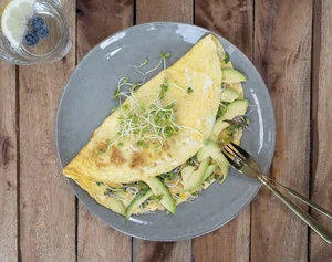 Omelette with avocado and garden cress