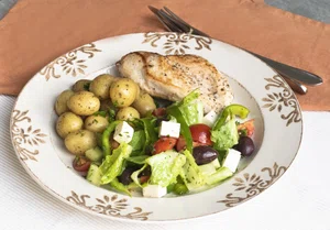 Chicken breast with baby potatoes and Greek salad
