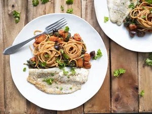 Spaghetti with pumpkin, chard and fried sea bass