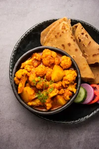 Potato and cauliflower curry with paratha