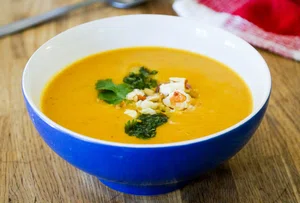 Pumpkin soup with hazelnut and feta crumble