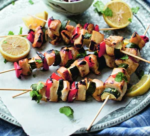 Chicken skewers with corn and rice salad