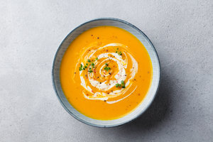 Carrot and sweet potato soup with ham