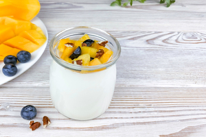 Greek yogurt with mango and pecan nuts