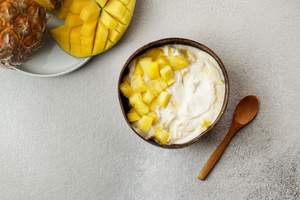 Tropical fruit with lime and ginger syrup and mascarpone yoghurt