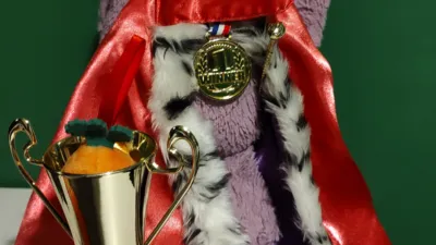 A purple bunny wearing a crown