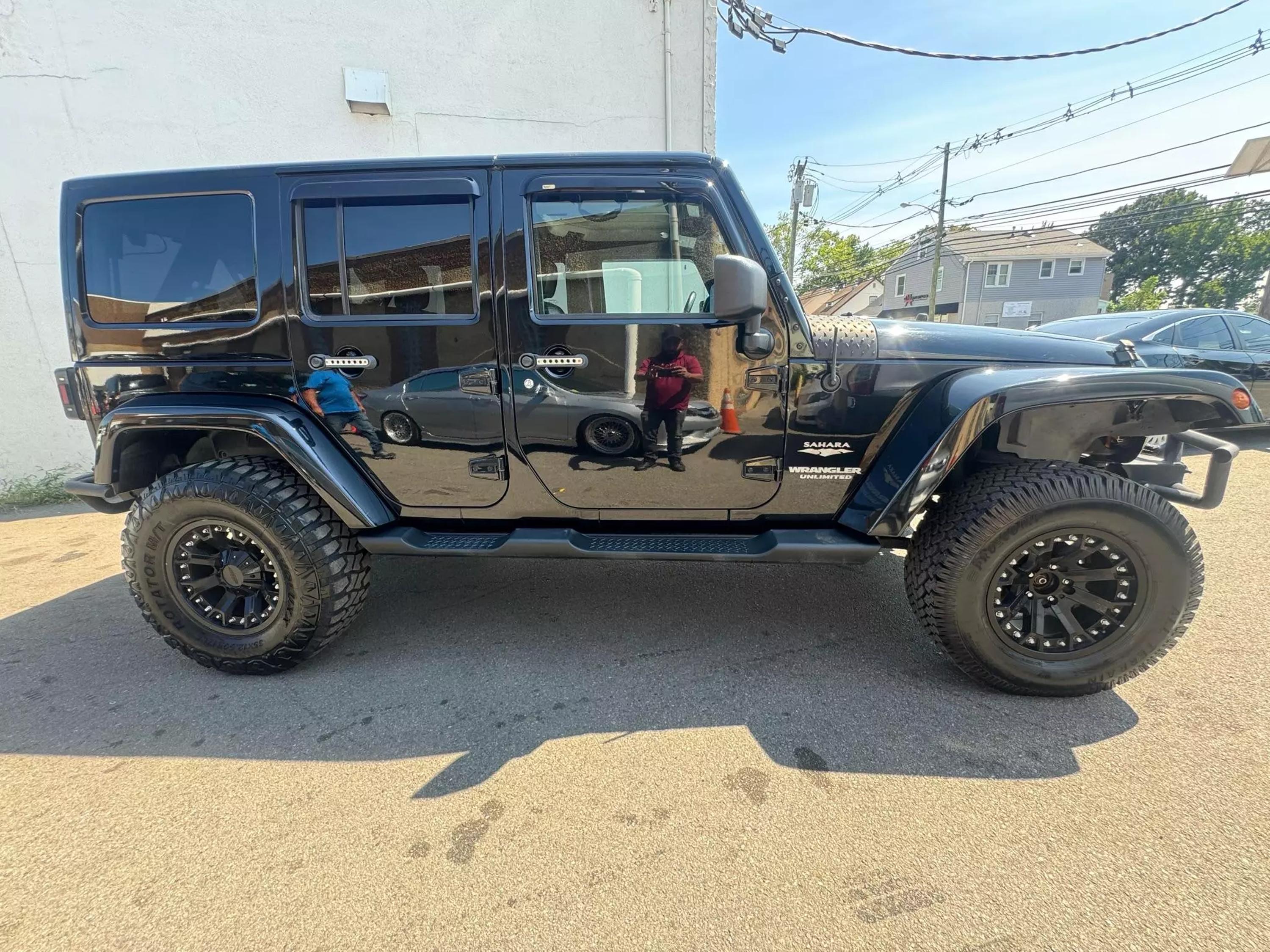 Used 2013 Jeep Wrangler Unlimited Sahara with VIN 1C4HJWEG4DL600016 for sale in Garfield, NJ