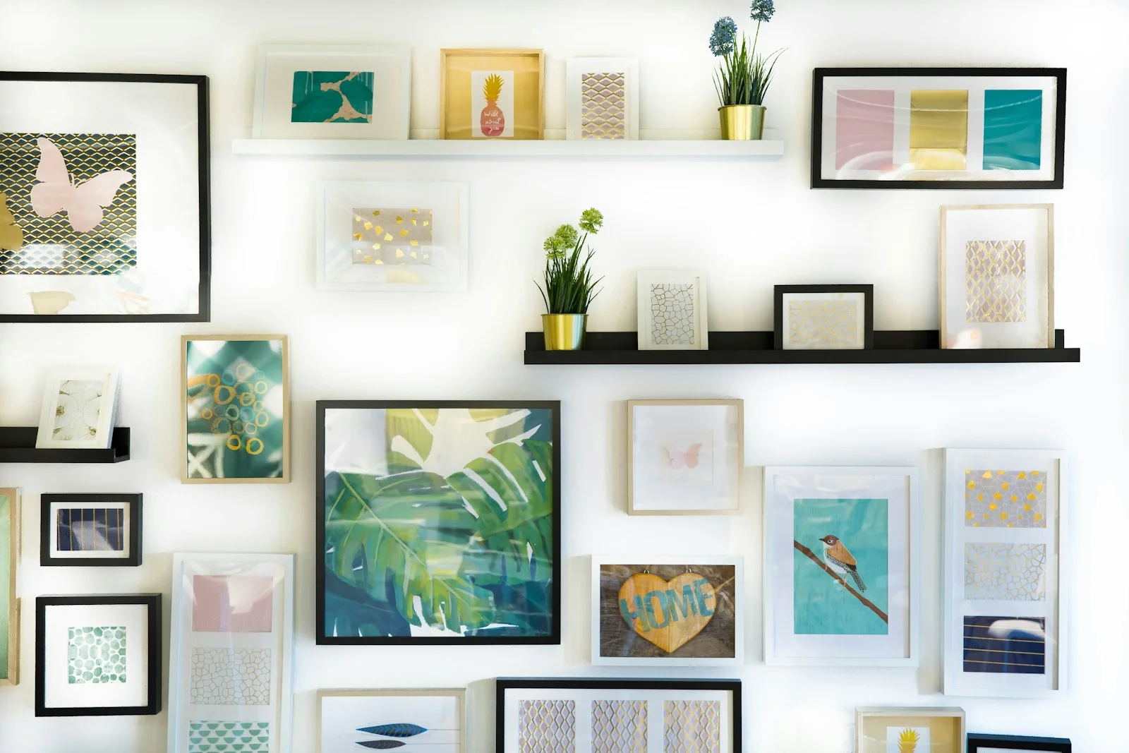 Framed botanical canvas on a warm plaster wall above a soft chair