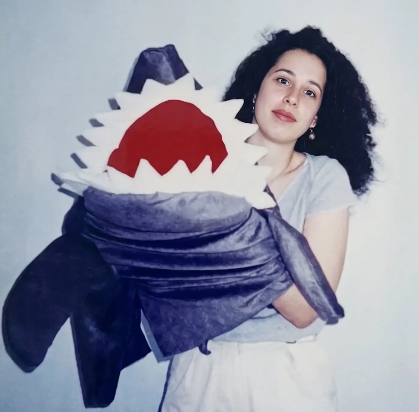 Tashi holding a handmade theatrical character