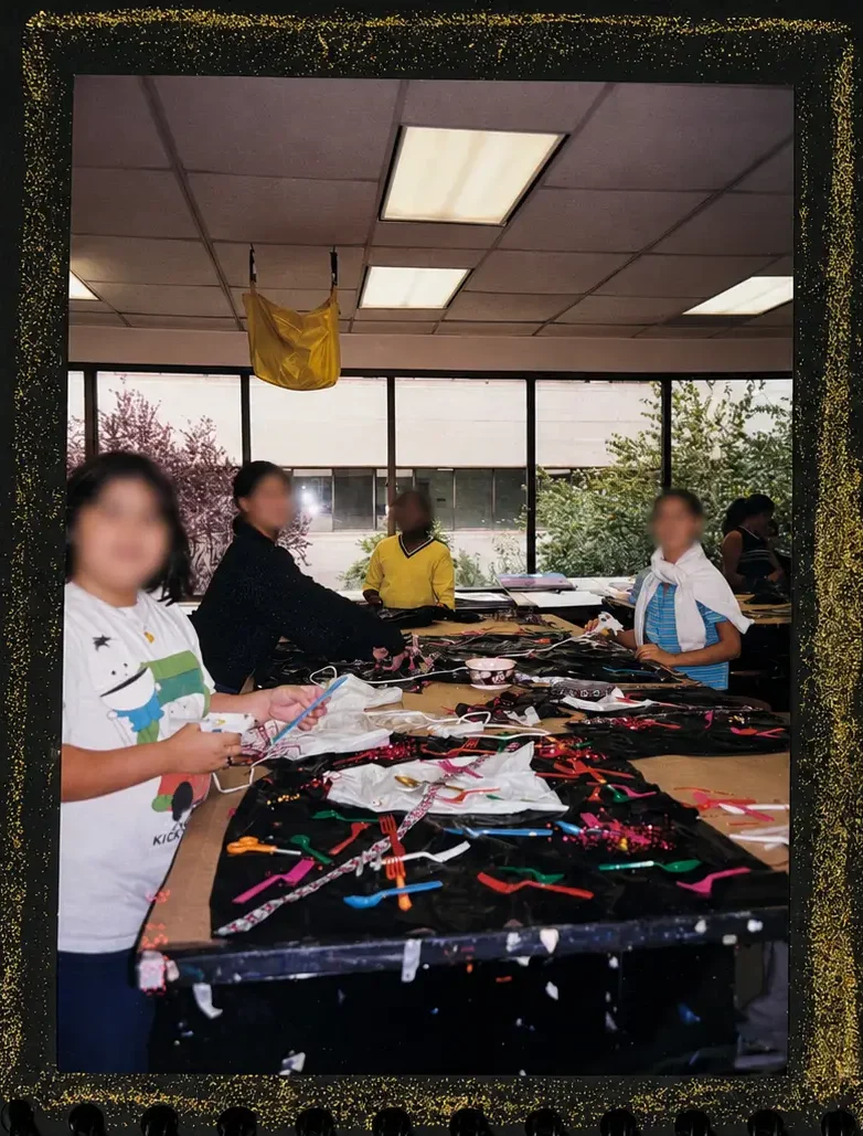 Students creating wearable sculptures from recycled materials in art class