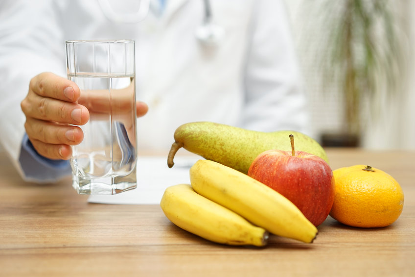 An image of fruits and a glass of water