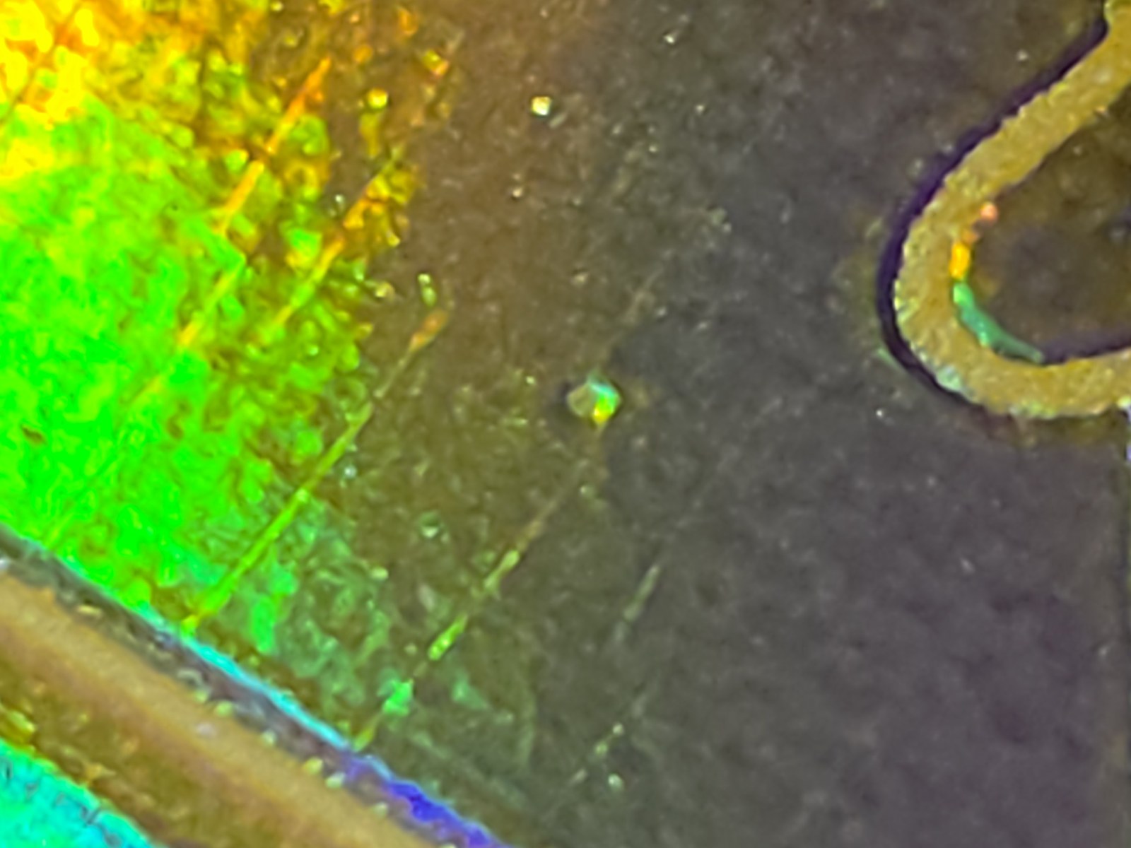 The same mark, angled to show it still reflects - the test for pass or fail.