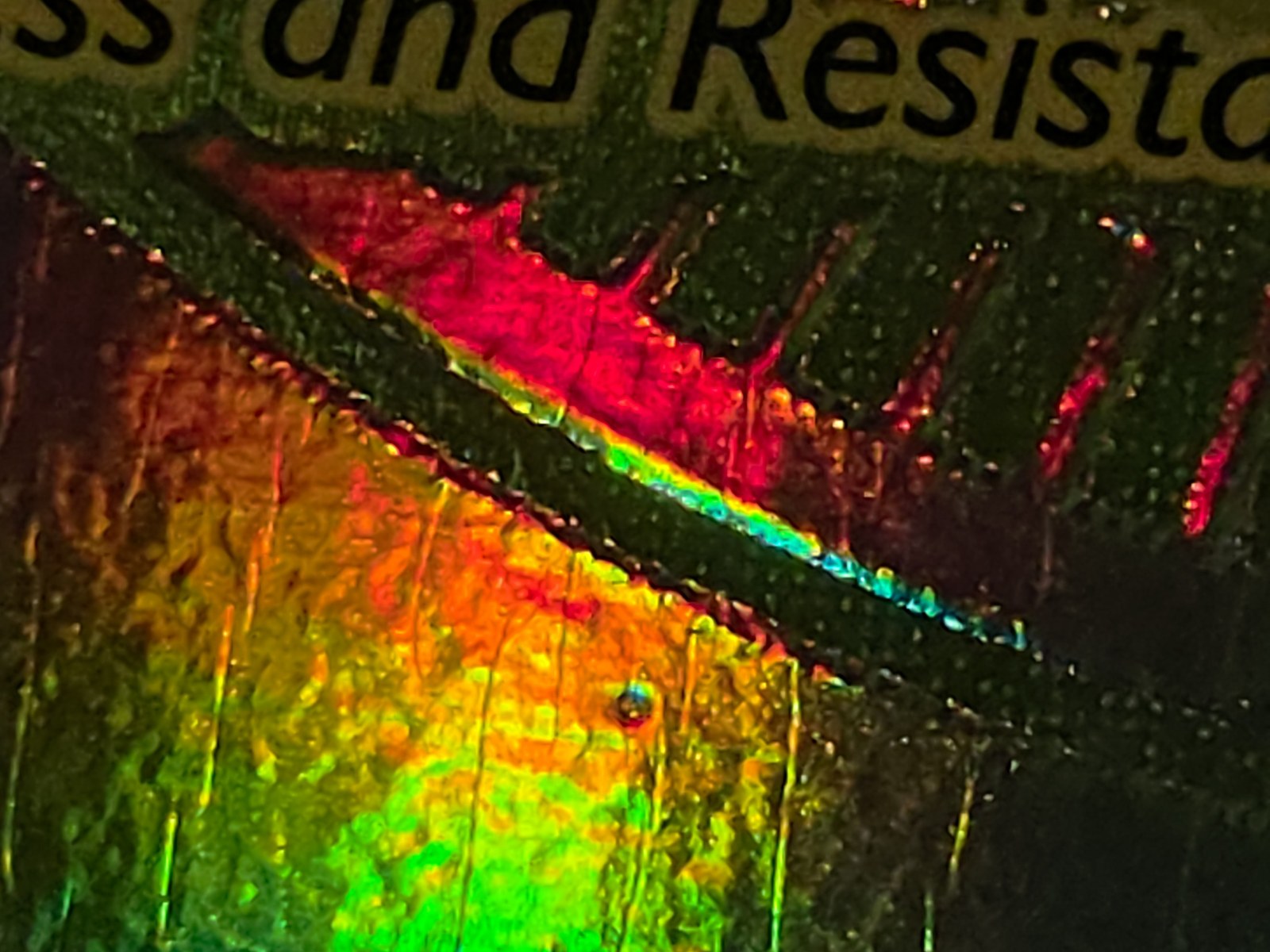 The second front defect, about 3/4 inch in from the left and up from the bottom.