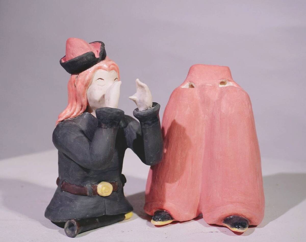 吹笛手,腿部為雙管陶笛