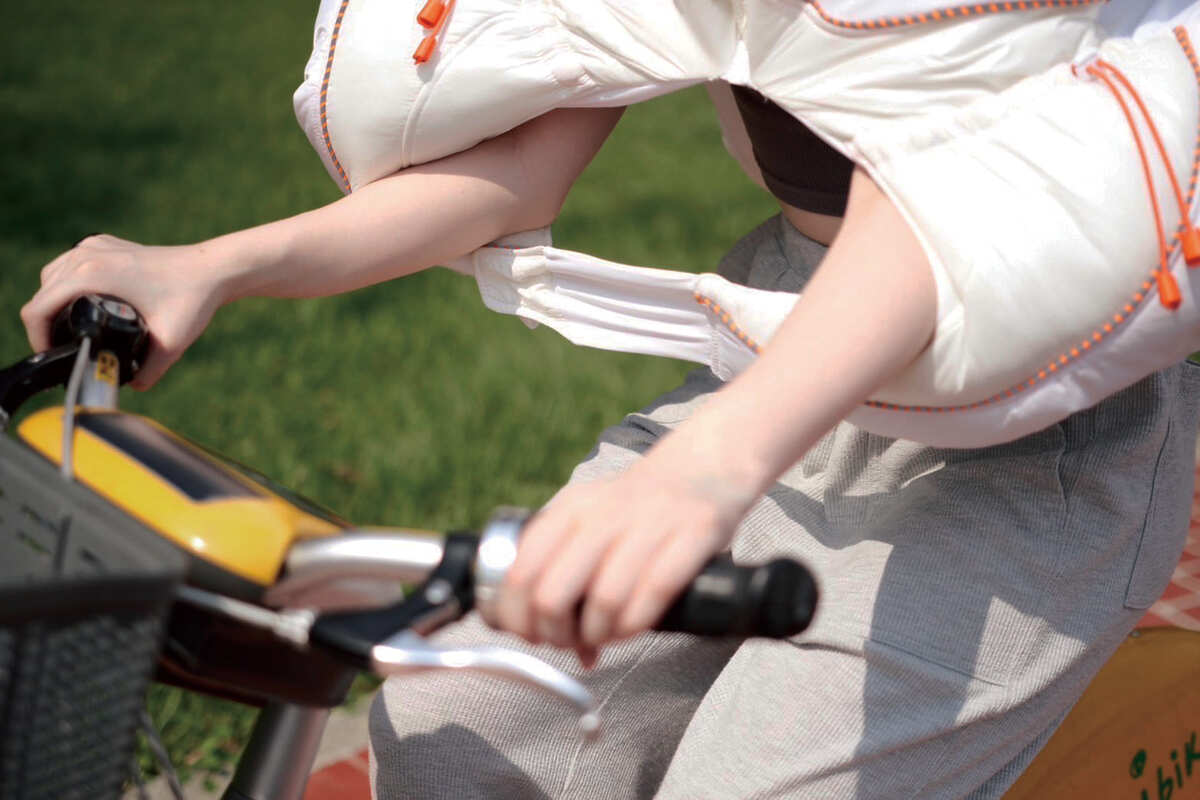 Hands sticking out of openings while riding.
