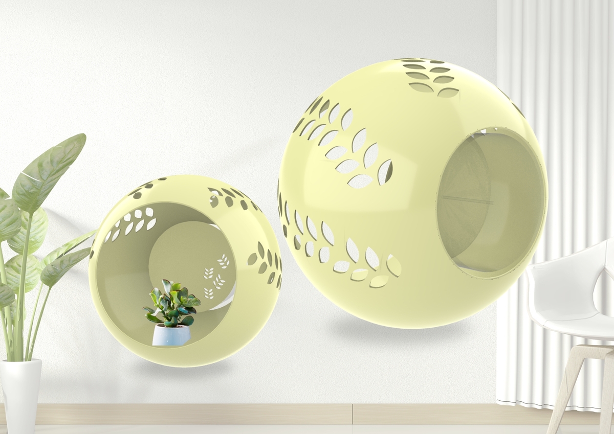 葉子造型的挖洞效果，中間可以種植植物
且樹葉長出洞外呈現不同樣貌，外觀呈現
葉子泛黃，後面香氛盒可以散發花香，像
在花園裡一樣放鬆，還有像時鐘一樣的孔
洞可以掛在牆上。