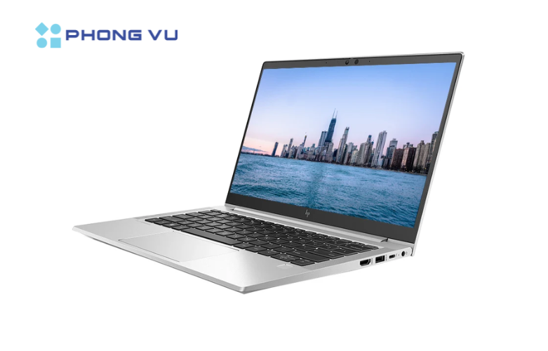 A computer with a city on the screen
Description automatically generated