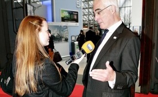 Alistair Darling is interviewed by a reporter after presenting at the Gathering