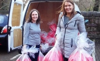 Paula Swanston and Jenny Baird unloading the food parcels