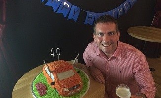 Happy birthday to moo: Graeme on his 40th with a cow car cake