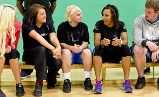 Dame Kelly Holmes with young people taking part in a charity programme in Manchester