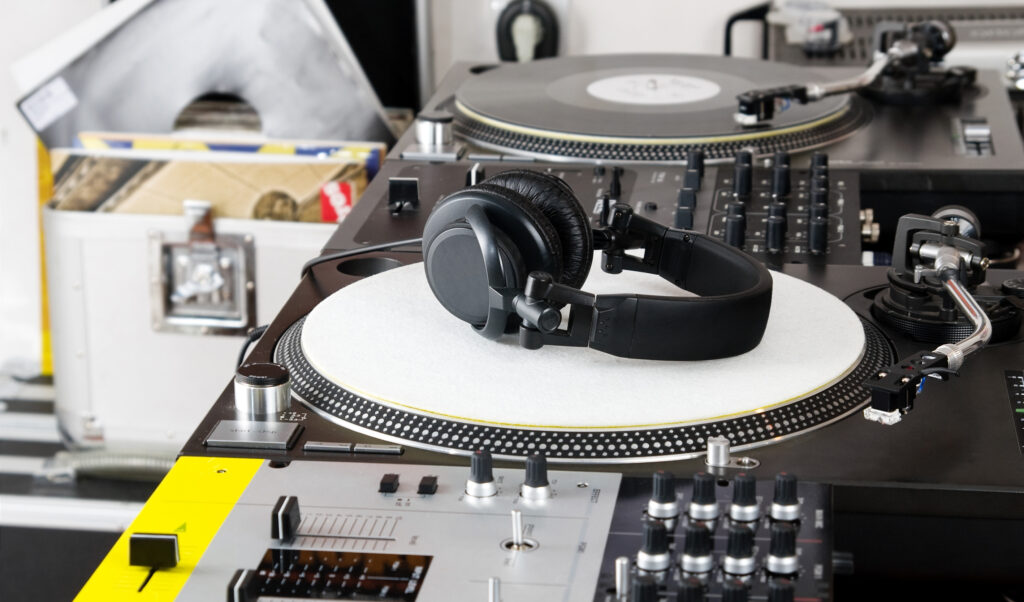 Headphones, mixer and turntable