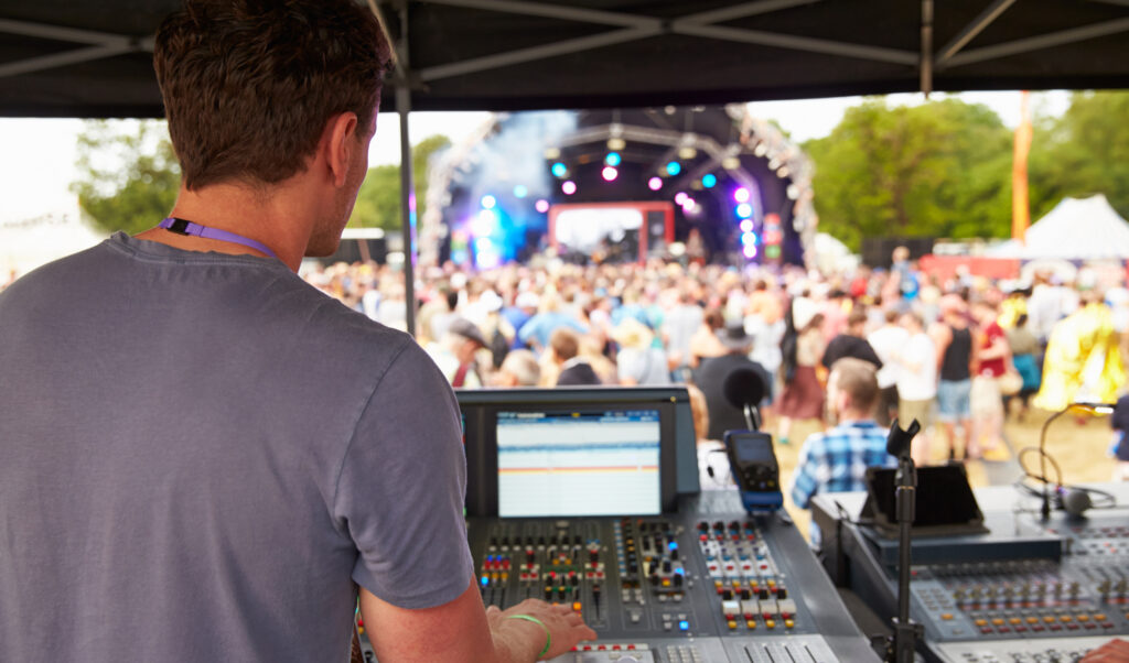 Sound and lighting engineer at an outdoor festival concert