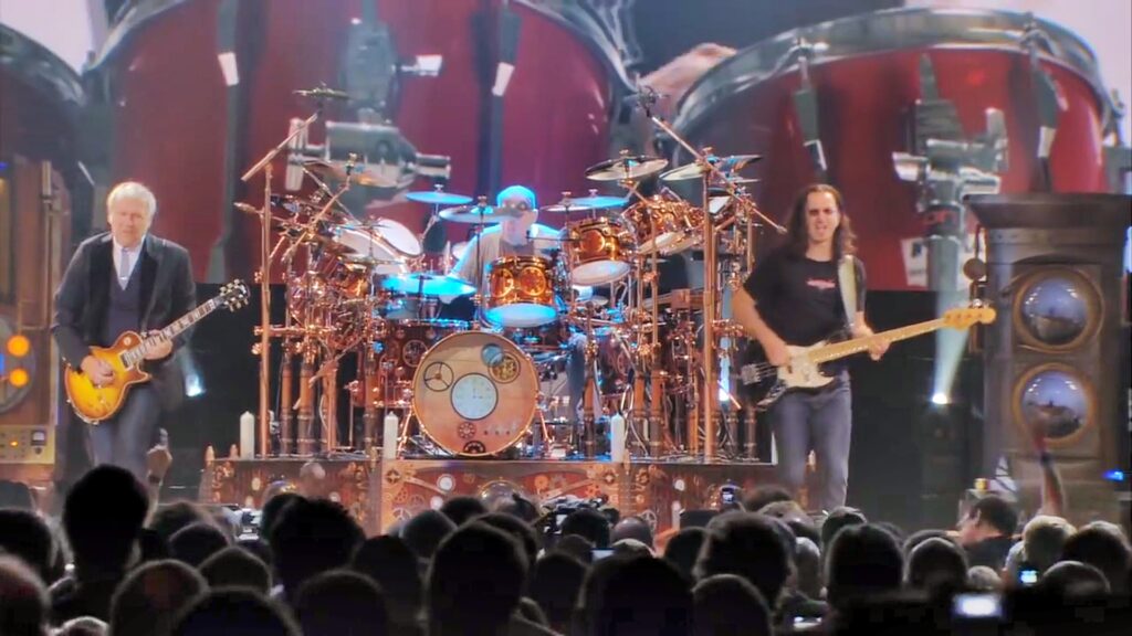 Rush live auf der Bühne (Bildquelle: www.youtube.com/watch?v=WJoTxywiRG0)