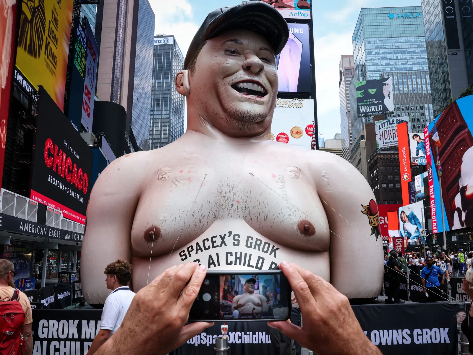 Times Square inflatable Musk warns investors with Grok child-sex abuse claims before SpaceX IPO