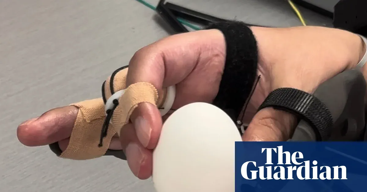 Keith Thomas uses a “double neural bypass” to feed himself after 6-year paralysis