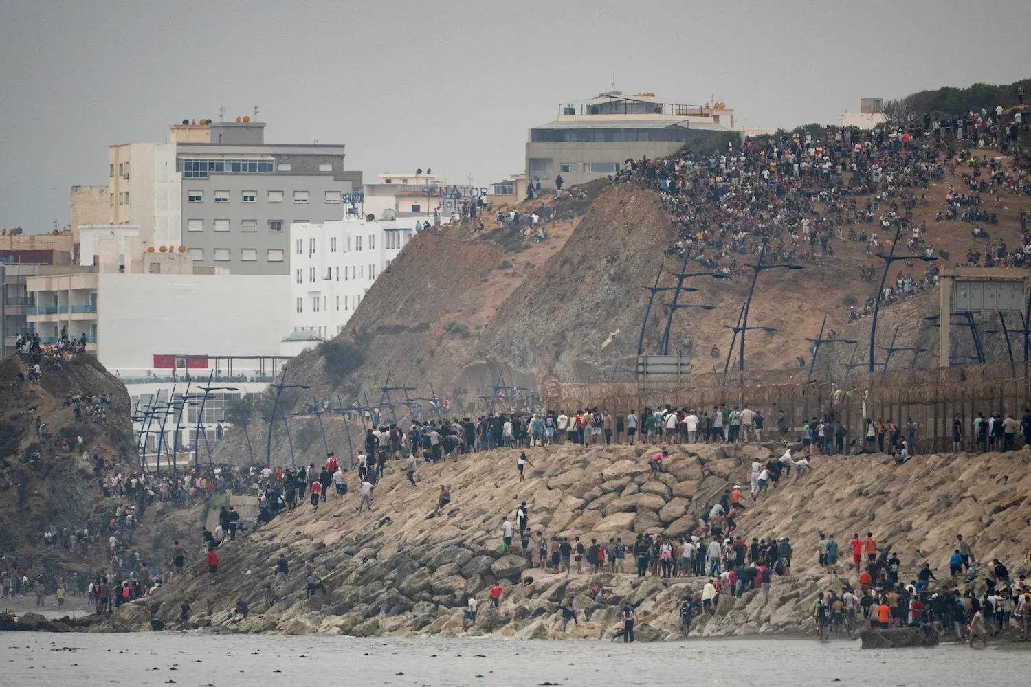 60,000 Moroccan migrants surge into Spain's Ceuta, triggering immediate political and border pressure