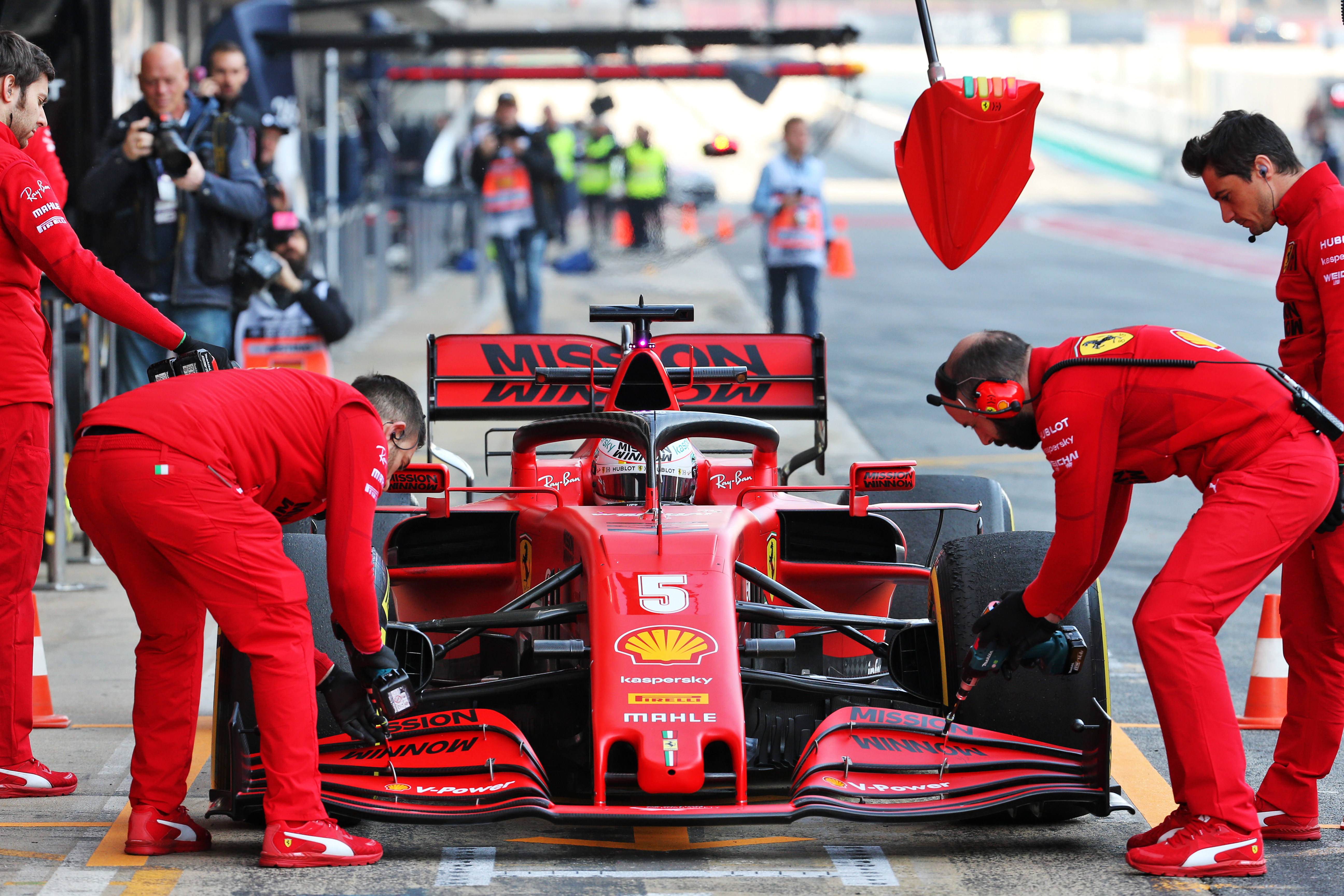 Ferrari Sebastian Vettel F1 testing wing adjustment mechanics Barcelona