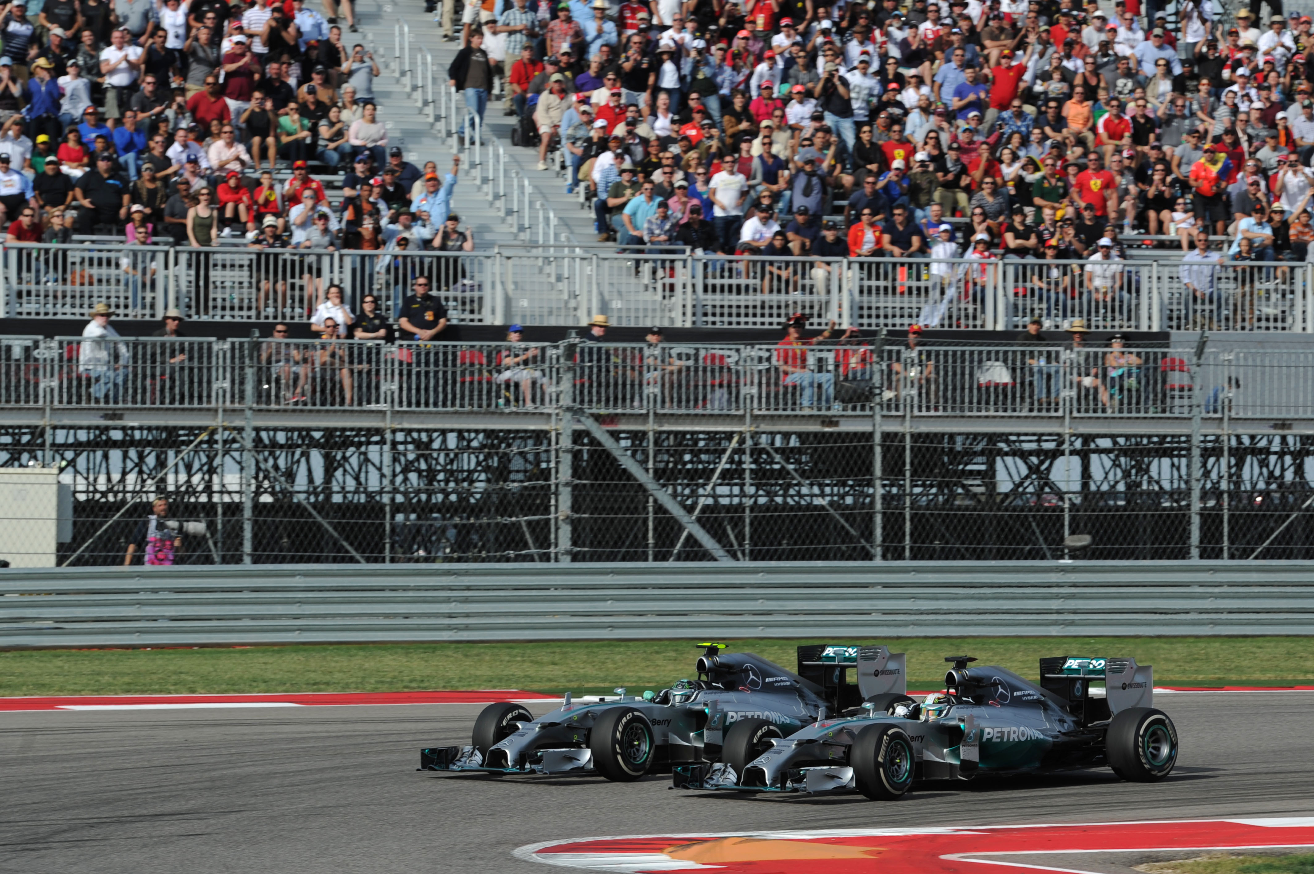 Lewis Hamilton passes Nico Rosberg Mercedes United States Grand Prix Austin 2015