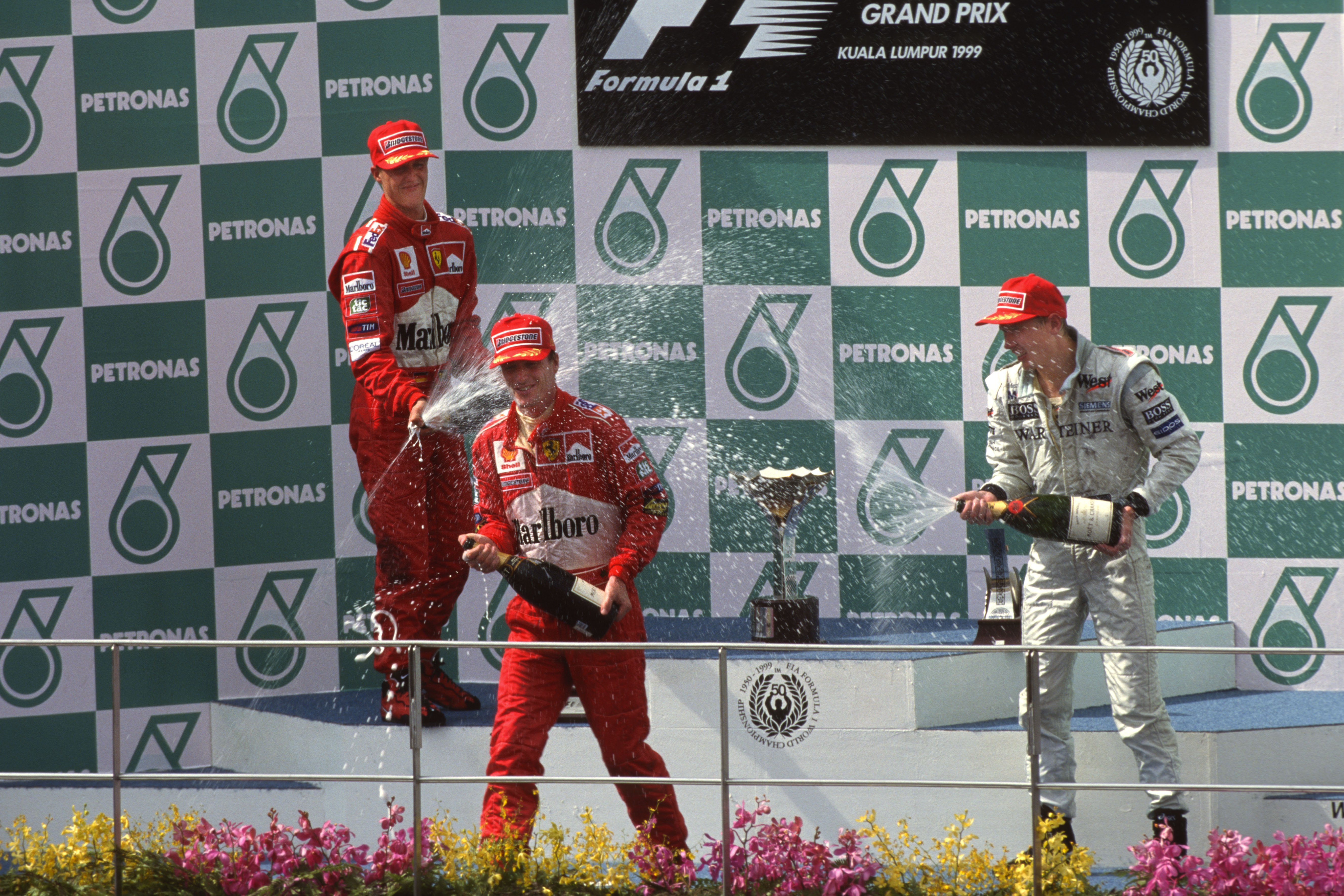 1999 Malaysian GP podium Eddie Irvine Michael Schumacher Mika Hakkinen F1 Ferrari McLaren Sepang