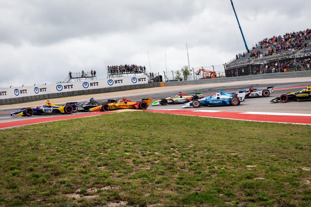 Alexander Rossi Leads A Group Of Cars Through Turn 1 At The Start Of The Indycar Classic Referenceimagewithoutwatermark M9348