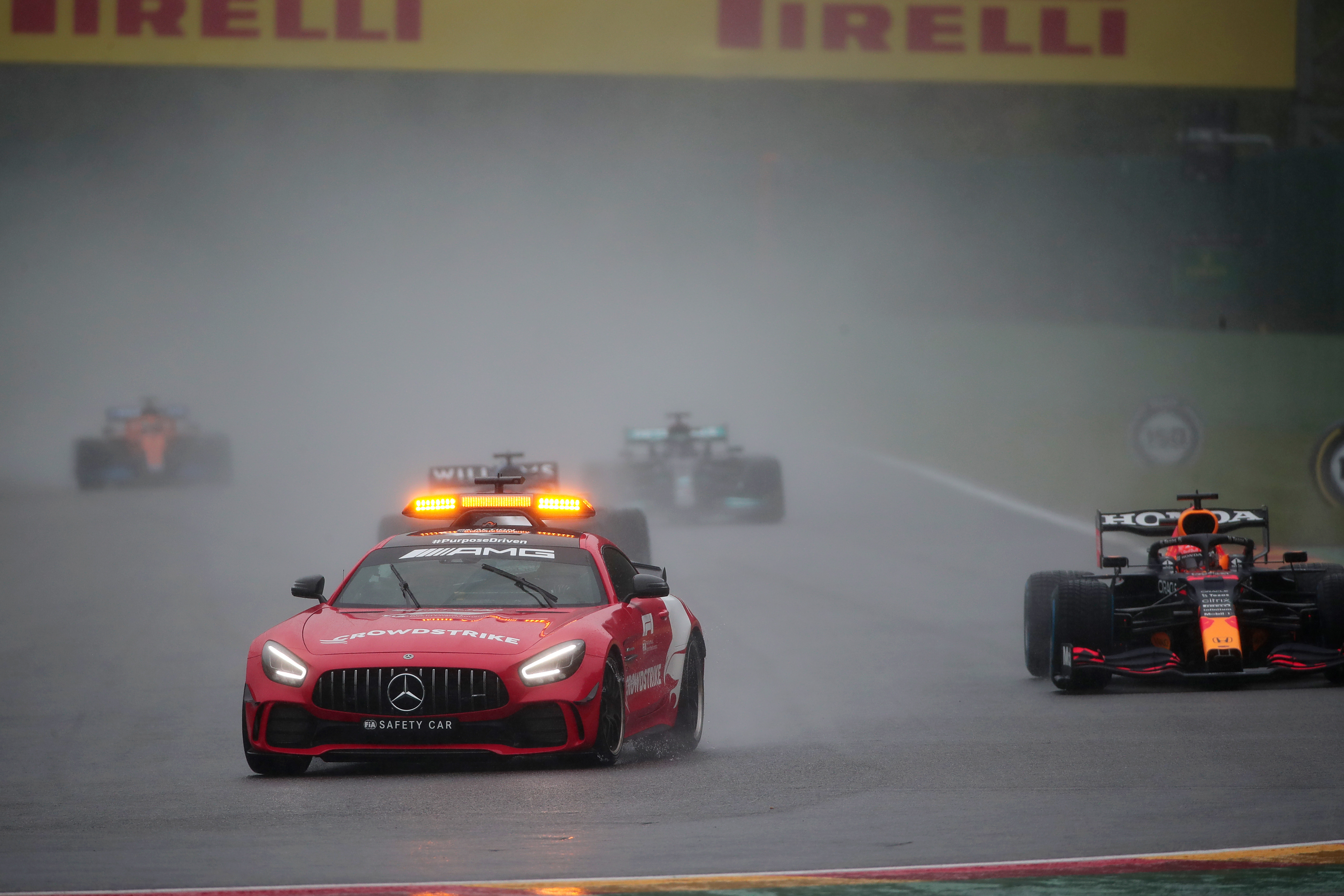 F1 Drivers sit in car